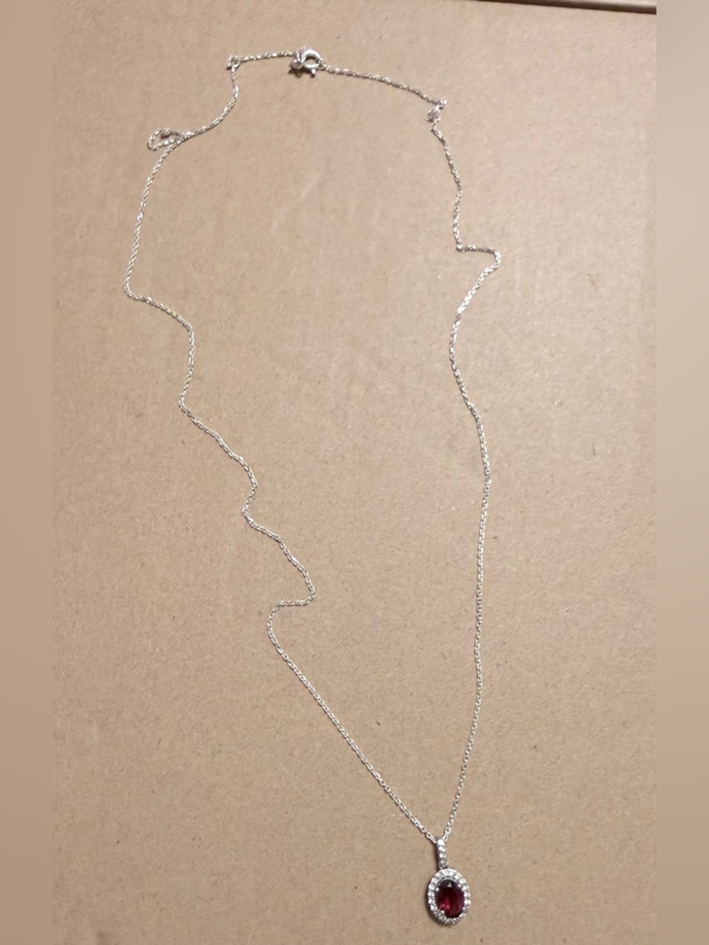 Sterling Silver Necklace with Red Oval Pendant and Halo Accents